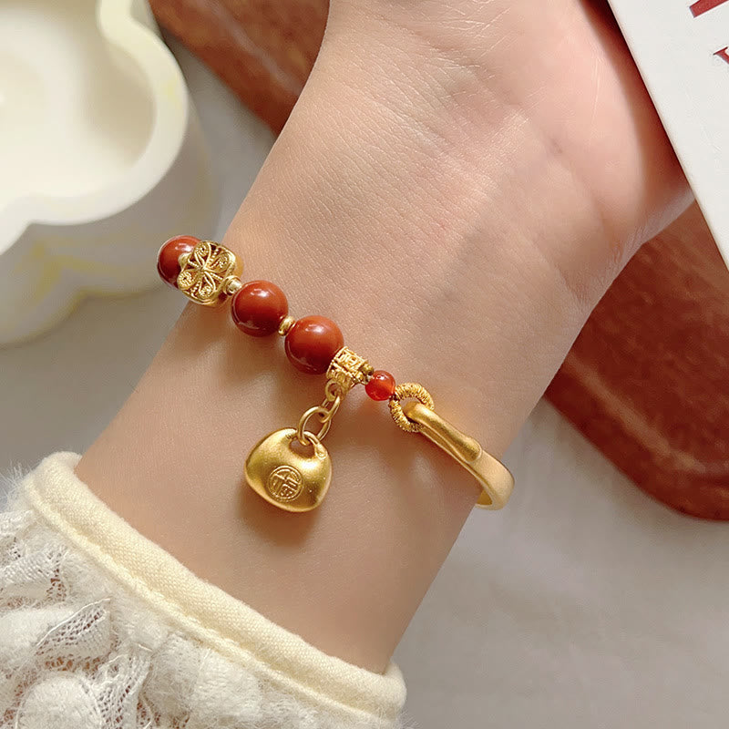 Bracelet demi-lingot en agate rouge du sud avec personnage Fu de Buddha Stones