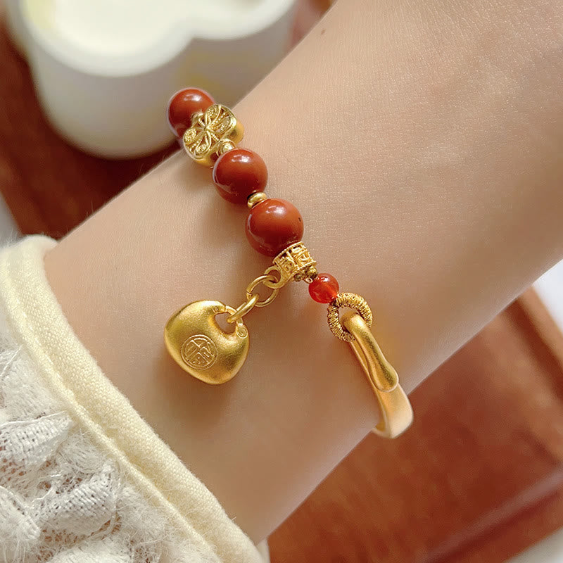 Bracelet demi-lingot en agate rouge du sud avec personnage Fu de Buddha Stones