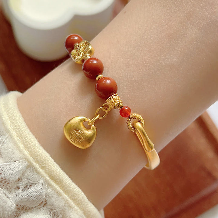 Bracelet demi-lingot en agate rouge du sud avec personnage Fu de Buddha Stones