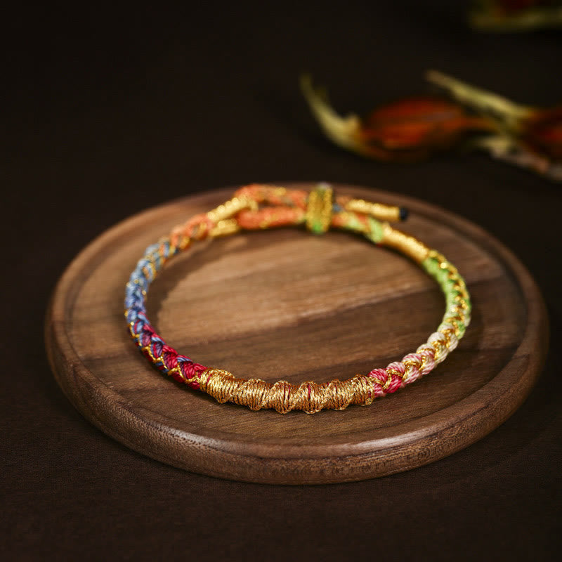 Bracelet tressé de protection en fil d'or coloré tibétain avec Buddha Stones et nœud en écailles de dragon