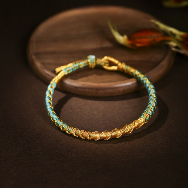 Bracelet tressé de protection en fil d'or coloré tibétain avec Buddha Stones et nœud en écailles de dragon