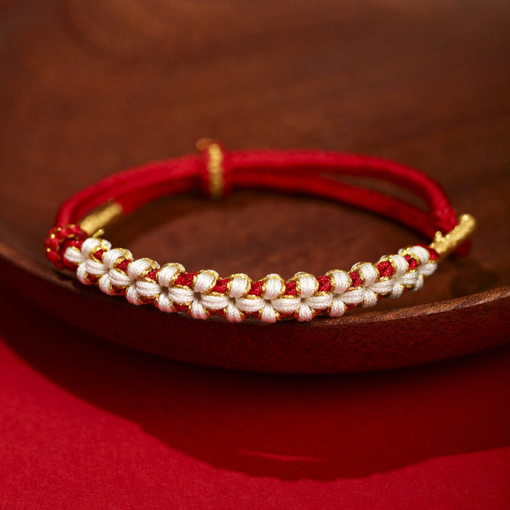 Bracelet tressé en fil d'or tibétain avec Buddha Stones et nœuds colorés en fleurs de pêcher