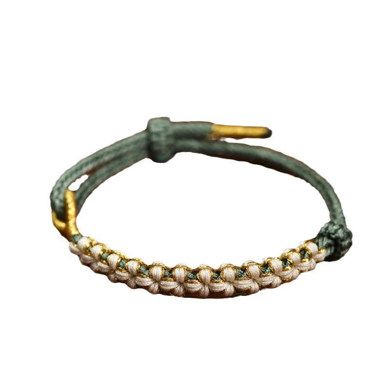 Bracelet tressé en fil d'or tibétain avec Buddha Stones et nœuds colorés en fleurs de pêcher