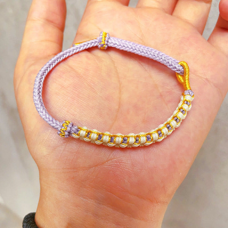 Bracelet tressé en fil d'or tibétain avec Buddha Stones et nœuds colorés en fleurs de pêcher