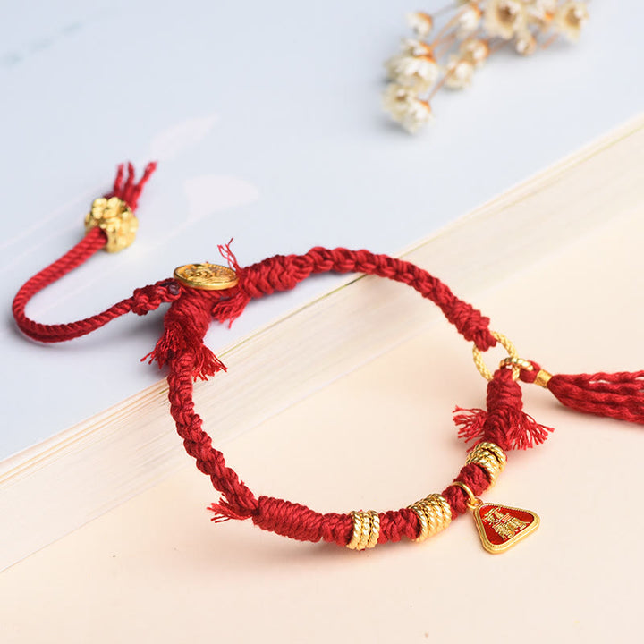 Bracelet tibétain en Buddha Stones avec pompon en forme de fleur et de déesse de la richesse Zakiram