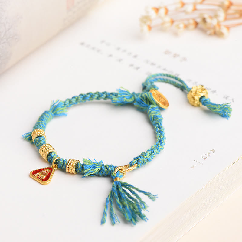 Bracelet tibétain en Buddha Stones avec pompon en forme de fleur et de déesse de la richesse Zakiram