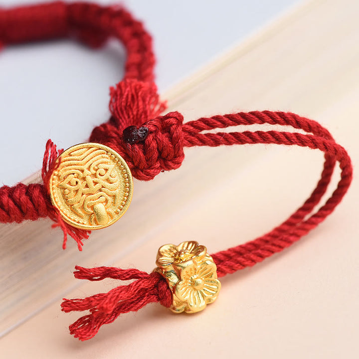 Bracelet tibétain en Buddha Stones avec pompon en forme de fleur et de déesse de la richesse Zakiram