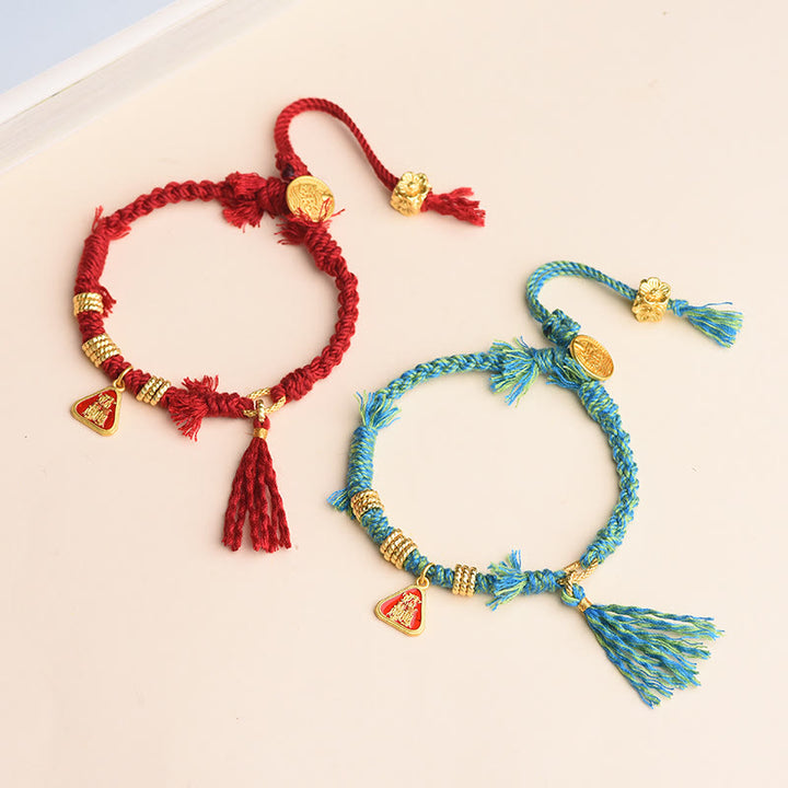 Bracelet tibétain en Buddha Stones avec pompon en forme de fleur et de déesse de la richesse Zakiram