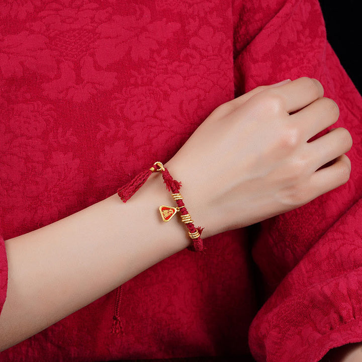 Bracelet tibétain en Buddha Stones avec pompon en forme de fleur et de déesse de la richesse Zakiram