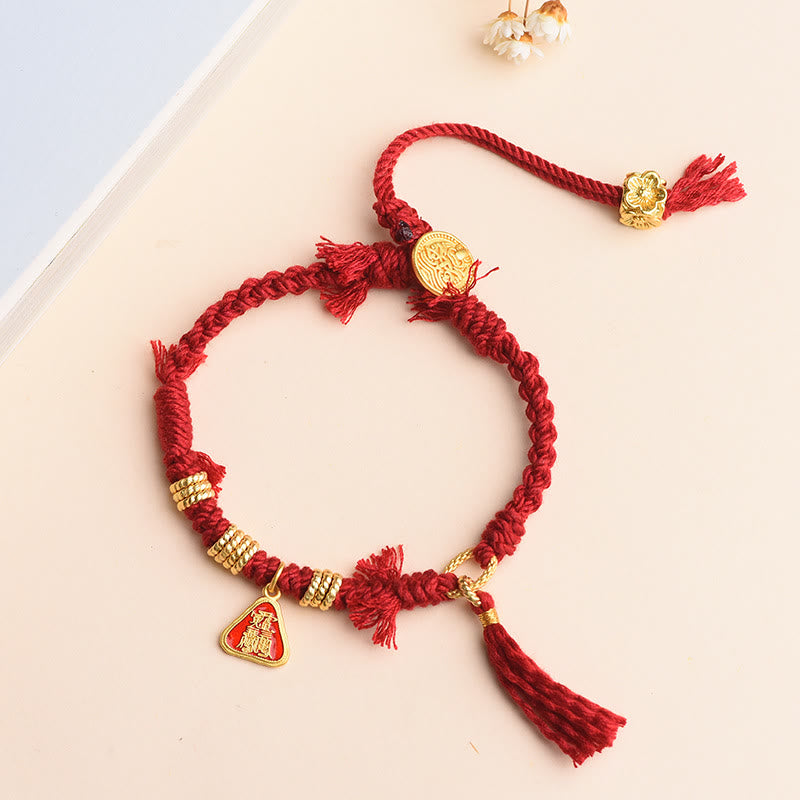 Bracelet tibétain en Buddha Stones avec pompon en forme de fleur et de déesse de la richesse Zakiram