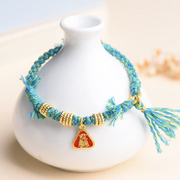 Bracelet tibétain en Buddha Stones avec pompon en forme de fleur et de déesse de la richesse Zakiram