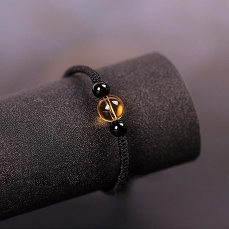 Bracelet en corde porte-bonheur avec nœud de paix et perles d'obsidienne noire en citrine fabriquées à la main par Buddha Stones