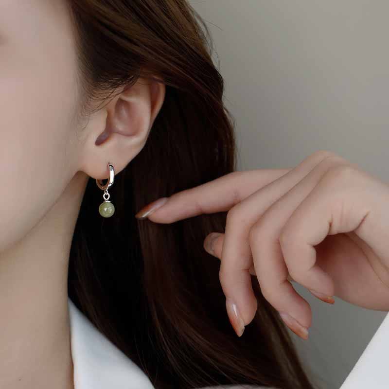 Boucles d'oreilles de prospérité en Buddha Stones