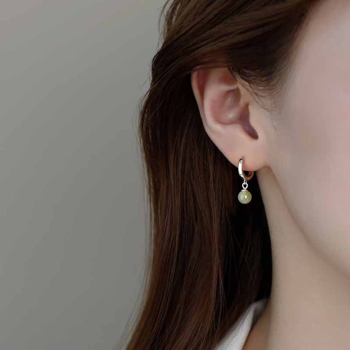 Boucles d'oreilles de prospérité en Buddha Stones