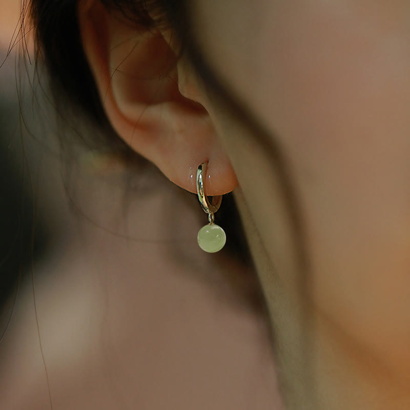 Boucles d'oreilles de prospérité en Buddha Stones