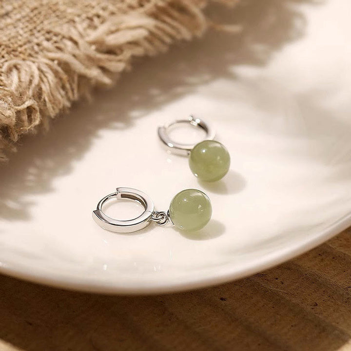 Boucles d'oreilles de prospérité en Buddha Stones