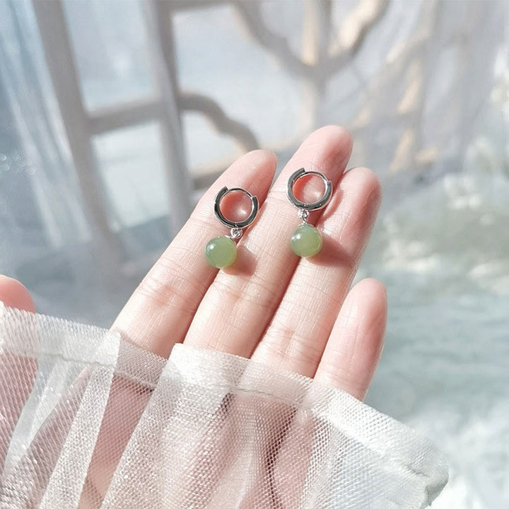 Boucles d'oreilles de prospérité en Buddha Stones