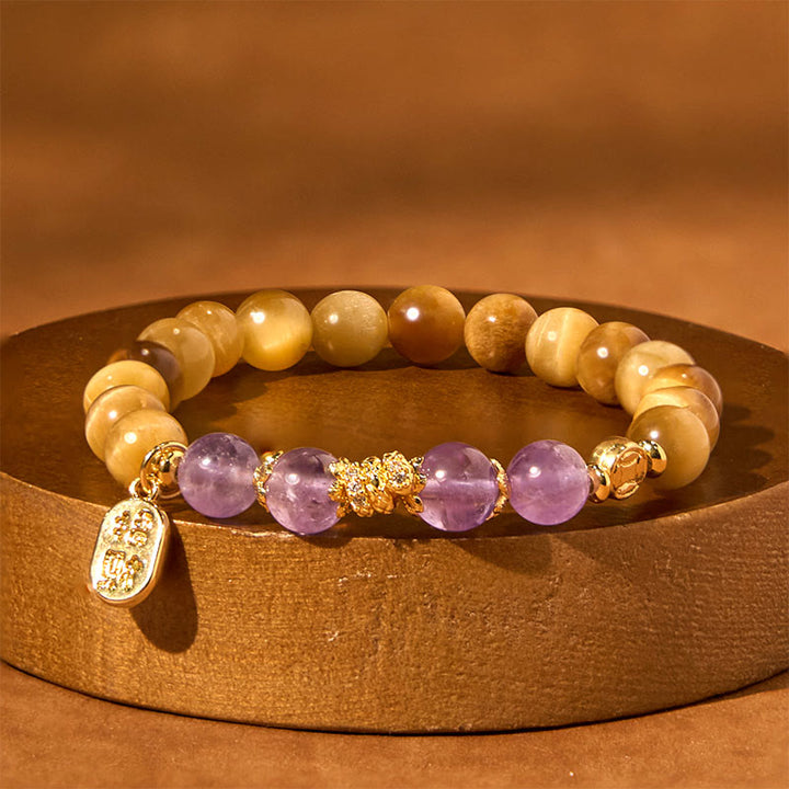 Bracelet de force de caractère Fu en Buddha Stones Année du serpent Oeil de tigre Améthyste