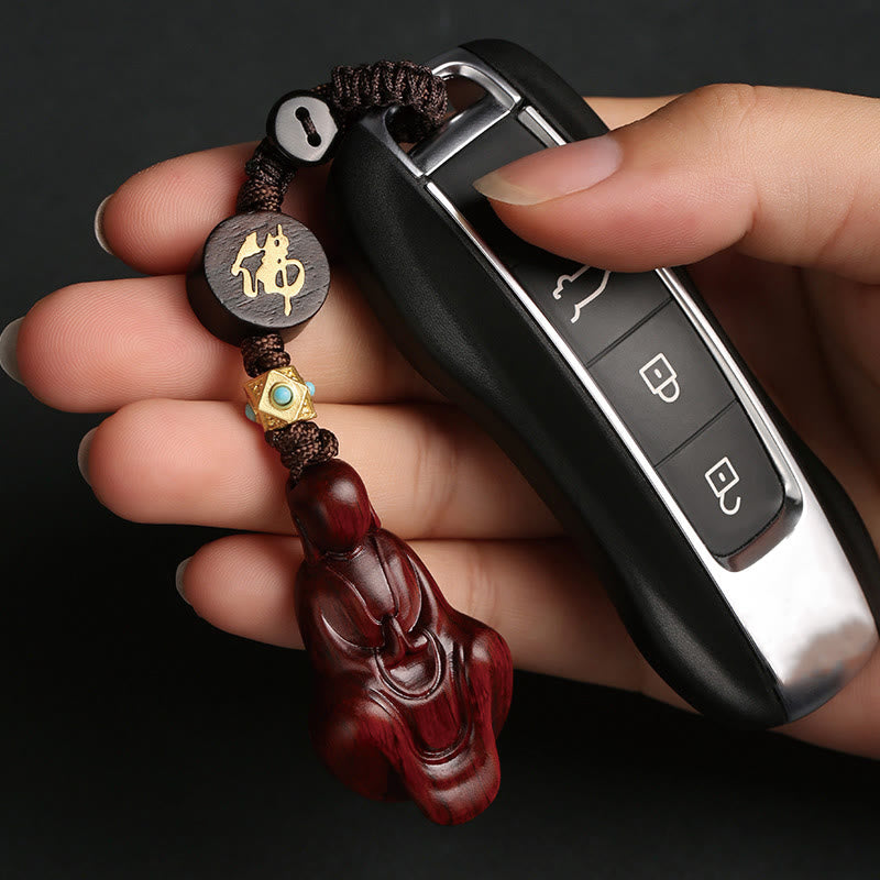 Porte-clés de protection Bouddha sans forme en bois de santal rouge à petites feuilles de Buddha Stones