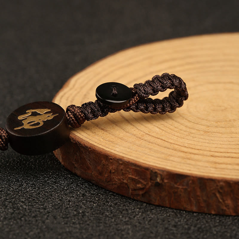 Porte-clés de protection Bouddha sans forme en bois de santal rouge à petites feuilles de Buddha Stones