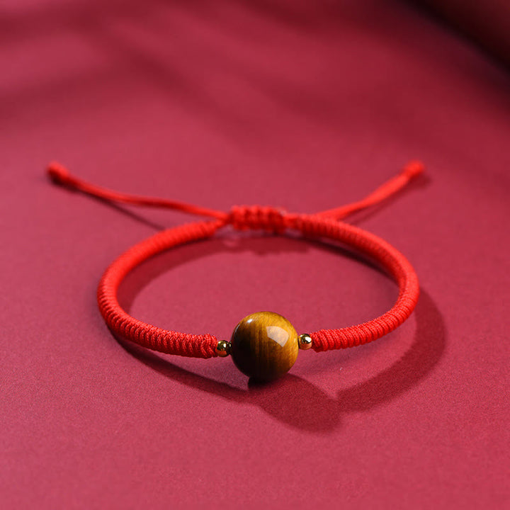Bracelet en corde de protection porte-bonheur en perles d'œil de tigre faites à la main avec des Buddha Stones