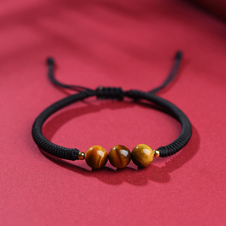 Bracelet en corde de protection porte-bonheur en perles d'œil de tigre faites à la main avec des Buddha Stones