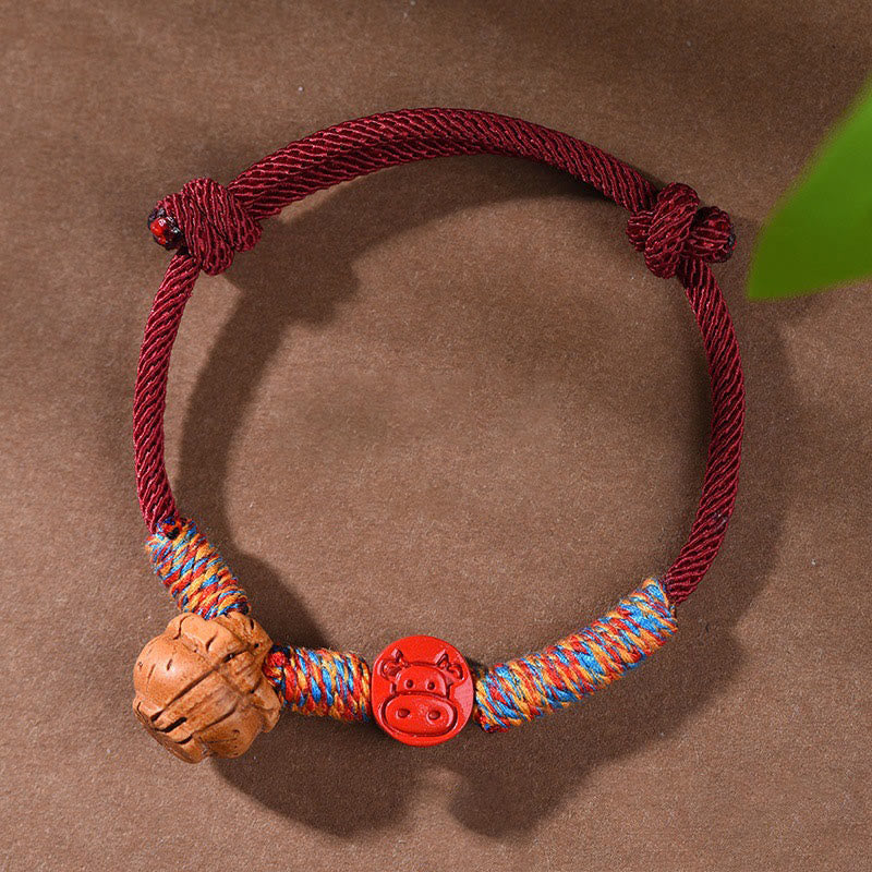 Bracelet porte-bonheur en cinabre et noyau de pêche en fil rouge fait main avec Buddha Stones et zodiaque chinois