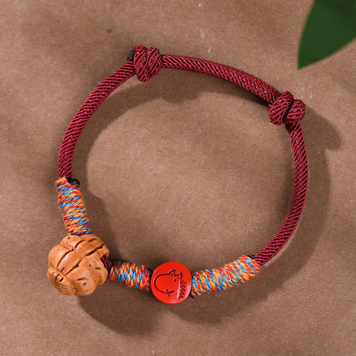 Bracelet porte-bonheur en cinabre et noyau de pêche en fil rouge fait main avec Buddha Stones et zodiaque chinois