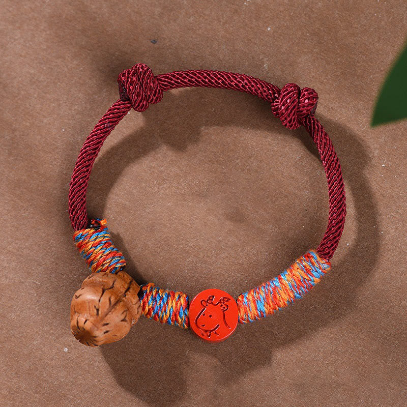 Bracelet porte-bonheur en cinabre et noyau de pêche en fil rouge fait main avec Buddha Stones et zodiaque chinois