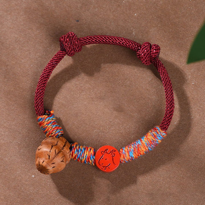 Bracelet porte-bonheur en cinabre et noyau de pêche en fil rouge fait main avec Buddha Stones et zodiaque chinois