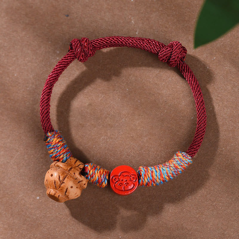 Bracelet porte-bonheur en cinabre et noyau de pêche en fil rouge fait main avec Buddha Stones et zodiaque chinois