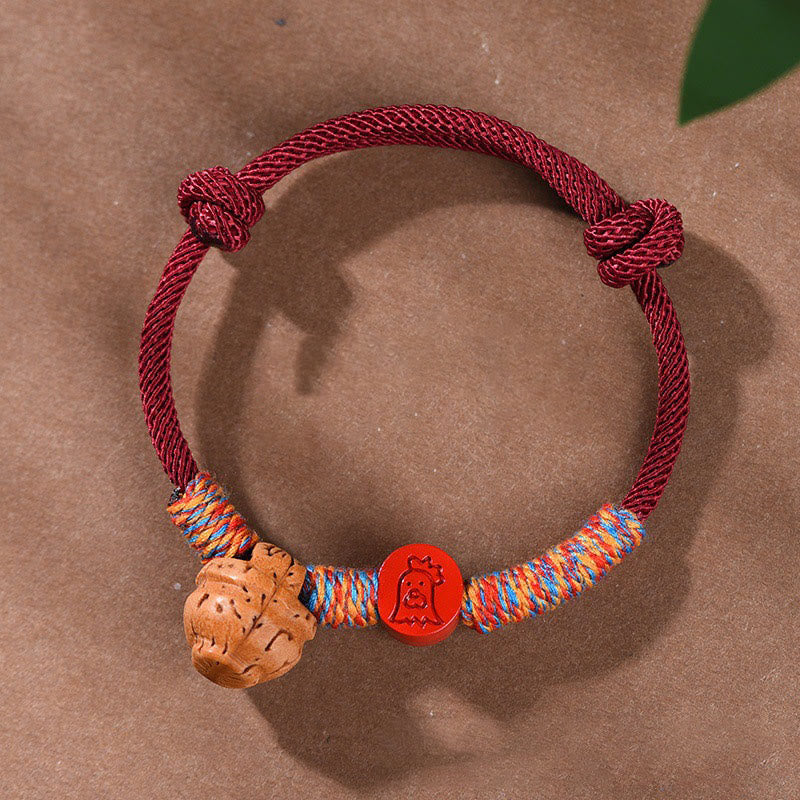 Bracelet porte-bonheur en cinabre et noyau de pêche en fil rouge fait main avec Buddha Stones et zodiaque chinois