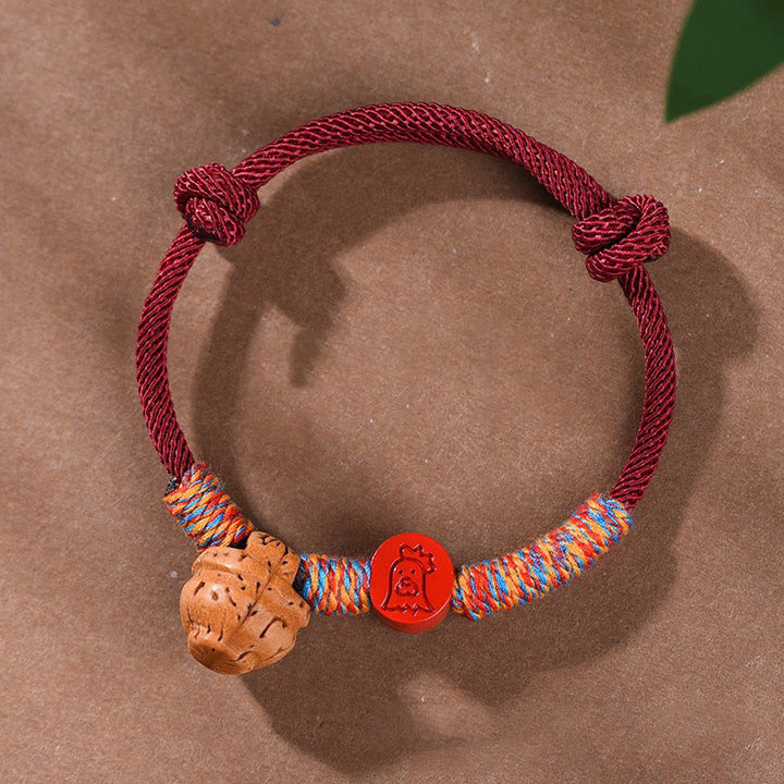 Bracelet porte-bonheur en cinabre et noyau de pêche en fil rouge fait main avec Buddha Stones et zodiaque chinois