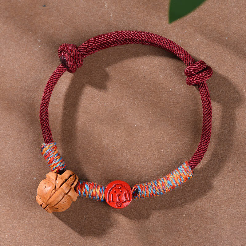 Bracelet porte-bonheur en cinabre et noyau de pêche en fil rouge fait main avec Buddha Stones et zodiaque chinois