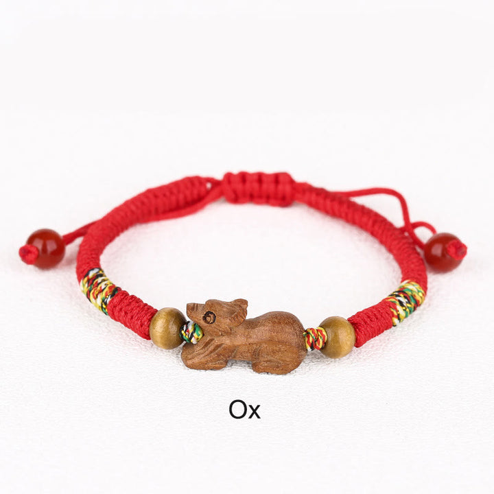 Bracelet porte-bonheur en bois de pêcher avec cordon rouge et signe du zodiaque chinois fait main par Buddha Stones