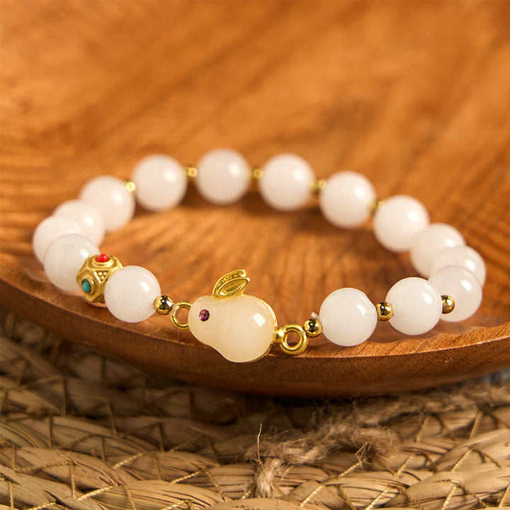 Bracelet porte-bonheur en jade et soie dorée avec Buddha Stones et lapin mignon
