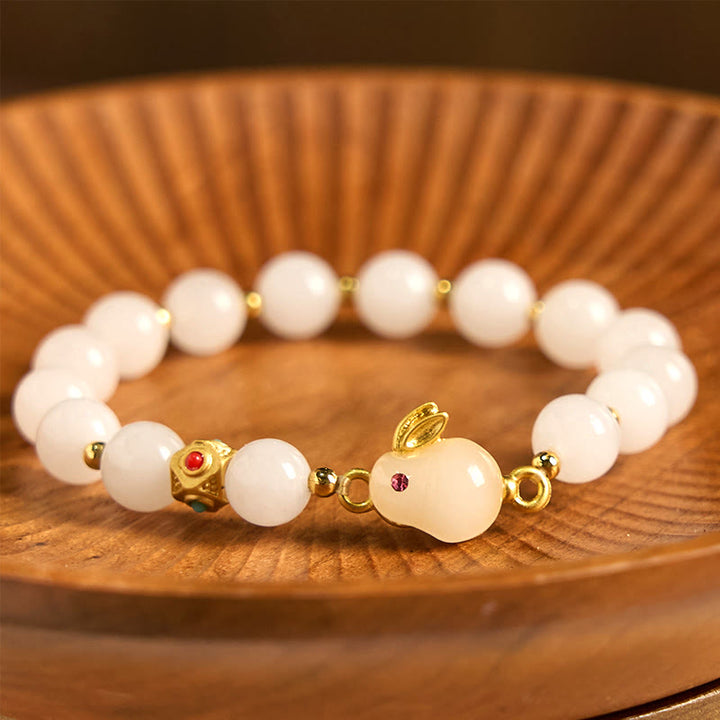 Bracelet porte-bonheur en jade et soie dorée avec Buddha Stones et lapin mignon