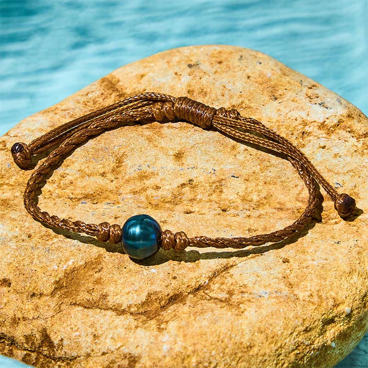Bracelet de sagesse en corde cirée avec perles noires naturelles de Tahiti et Buddha Stones