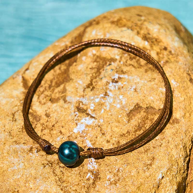 Bracelet de guérison en corde de cire avec perles noires naturelles de Tahiti et Buddha Stones