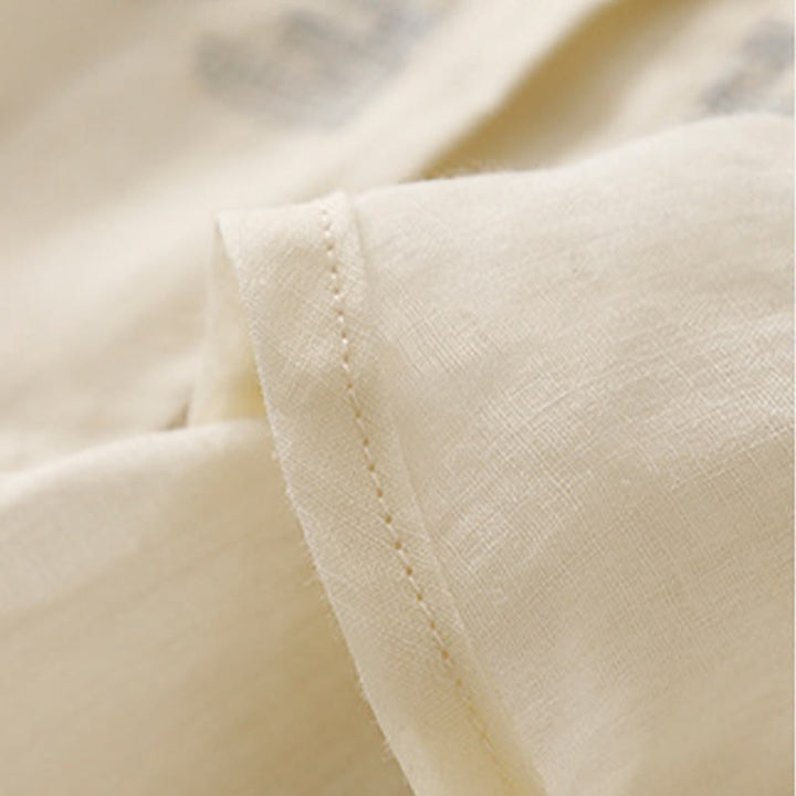 Chemise décontractée en coton à manches trois-quarts et col ras du cou avec broderies de plantes et boutons en forme de grenouille pour femmes Buddha Stones