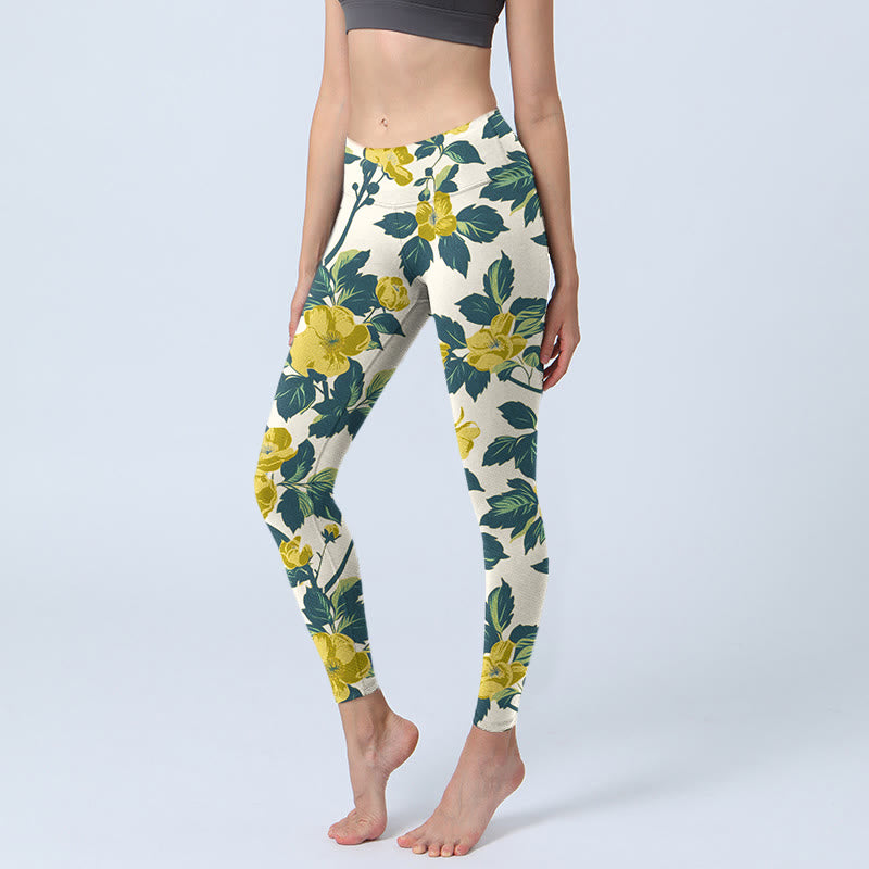Leggings de fitness et de gym imprimé Buddha Stones , fleurs jaunes et feuilles vertes, pantalons de yoga pour femmes - soie de maïs - US18，UK/AU22，EU50 (4XL) - image 0