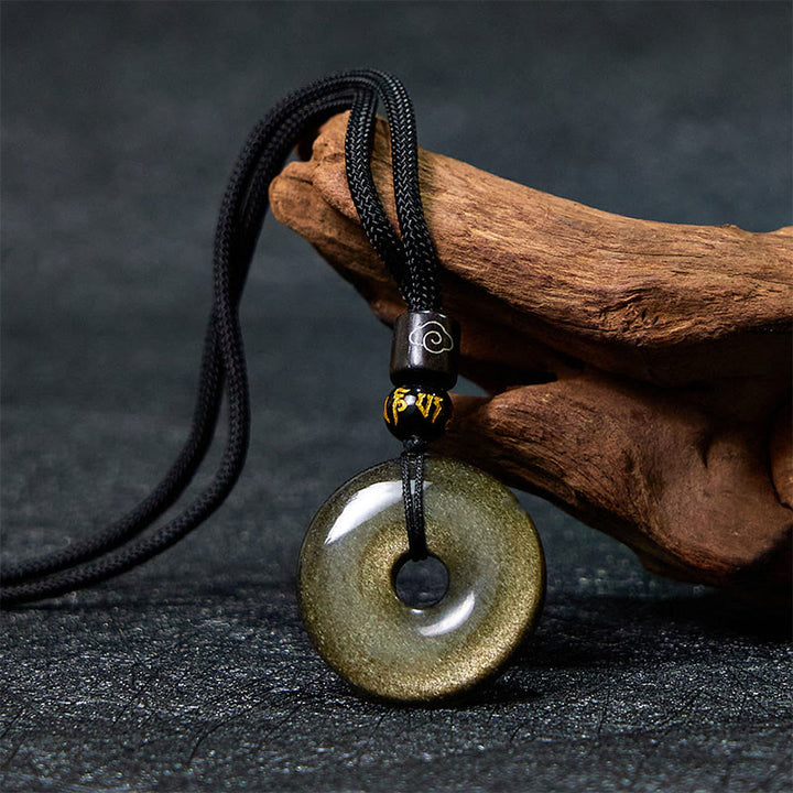Collier avec pendentif en obsidienne naturelle dorée et brillante de Buddha Stones
