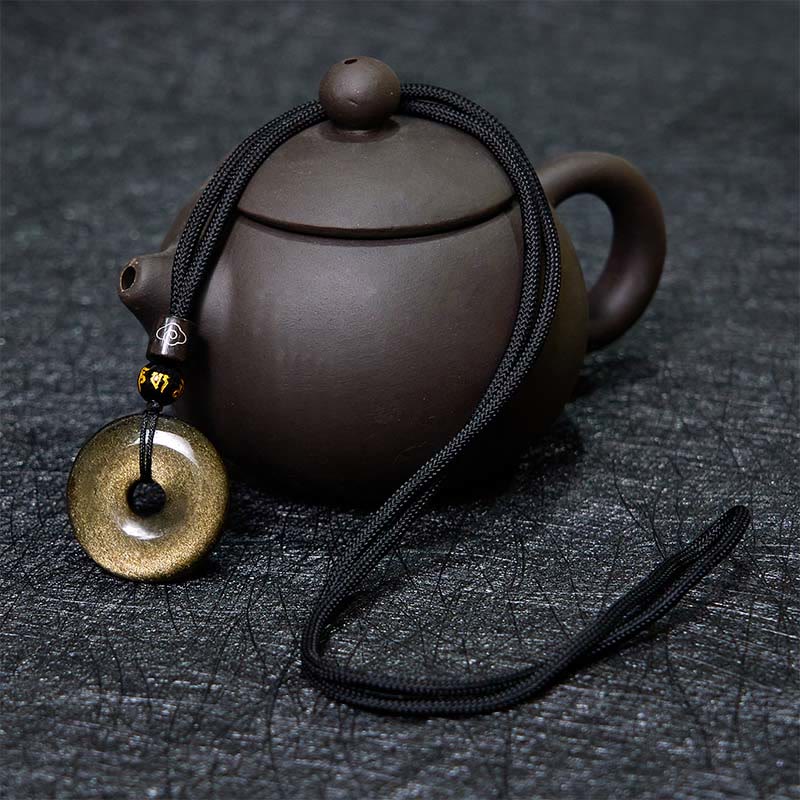Collier avec pendentif en obsidienne naturelle dorée et brillante de Buddha Stones