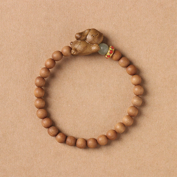 Bracelet positif en bois de santal vert et doré avec Buddha Stones et lapin mignon