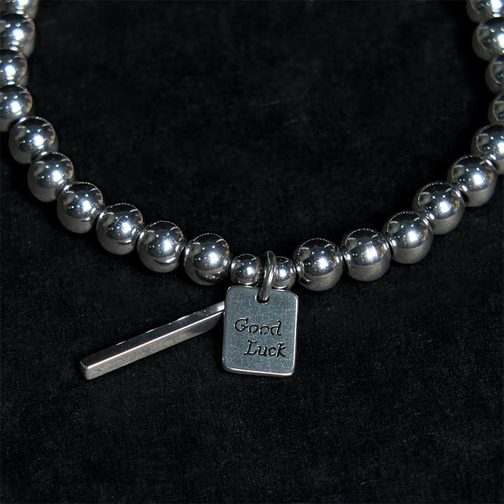 Bracelet porte-bonheur en acier titane et Buddha Stones