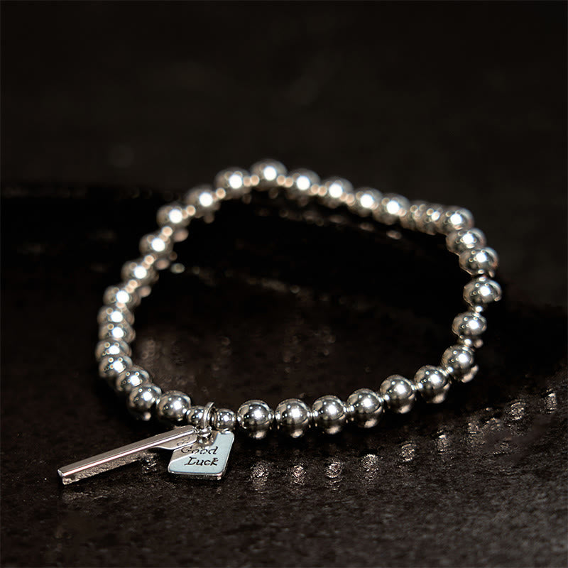 Bracelet porte-bonheur en acier titane et Buddha Stones