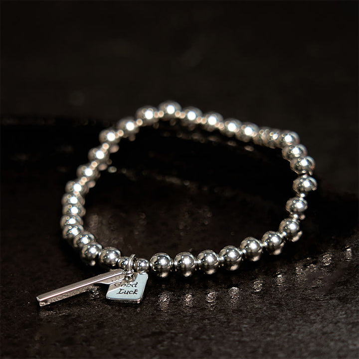 Bracelet porte-bonheur en acier titane et Buddha Stones