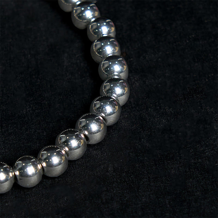 Bracelet porte-bonheur en acier titane et Buddha Stones