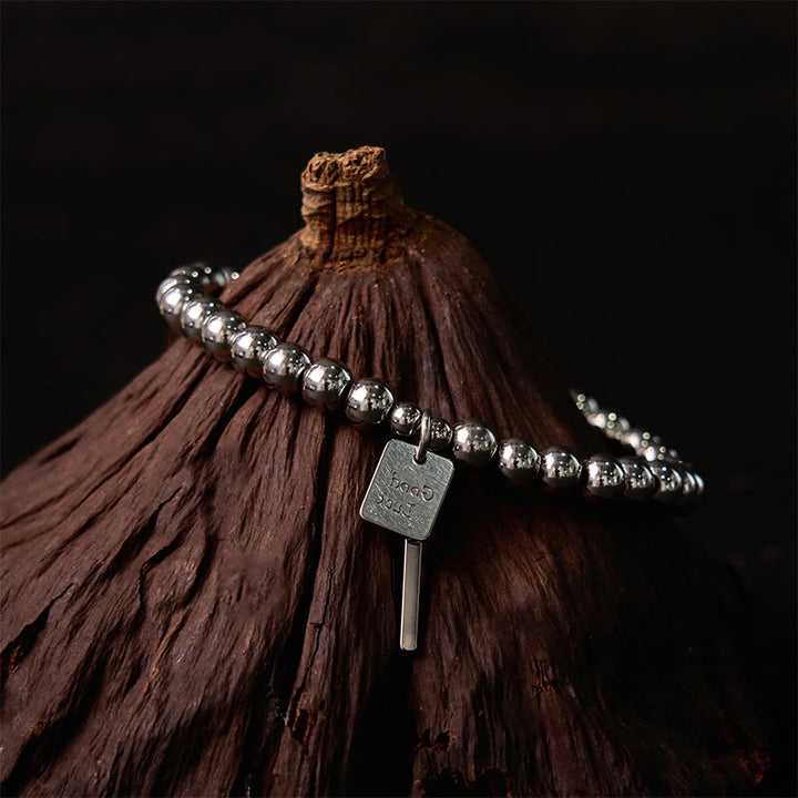 Bracelet porte-bonheur en acier titane et Buddha Stones