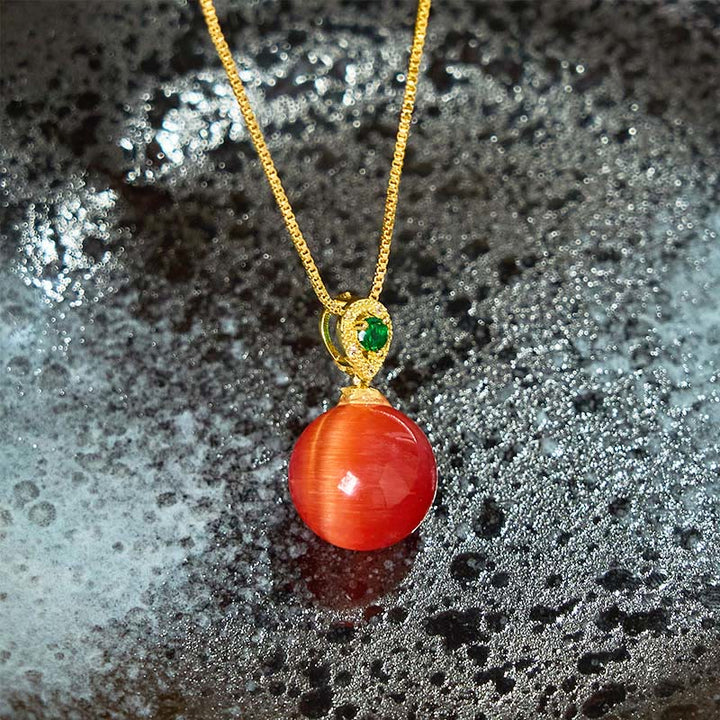 Collier avec pendentif boule ronde œil de chat en Buddha Stones